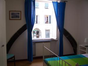 Postel nebo postele na pokoji v ubytování B&B Archi di Borgolungo