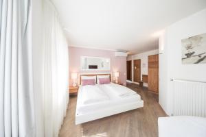 Postel nebo postele na pokoji v ubytování Boutique Hotel Zum Rosenbaum