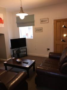 a living room with a couch and a coffee table at Primrose in Shrewsbury