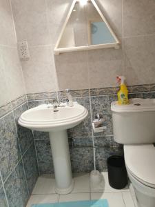 a bathroom with a sink and a toilet at MEDITERRANEAN VALLEY in Paphos City