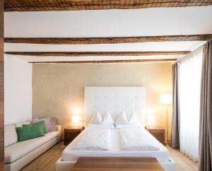 Postel nebo postele na pokoji v ubytování Boutique Hotel Zum Rosenbaum