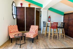 a kitchen with chairs and a table in a room at Hotel La Sin Ventura in Antigua Guatemala