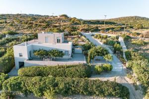 an aerial view of a white house with trees at Villa Iris in Livadi