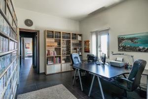 an office with a desk and chairs in a room at Villa Iris in Livadi