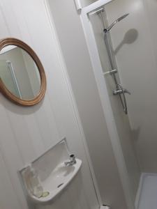 a bathroom with a toilet and a sink at Fairhaven Guest Accommodation in Nottingham