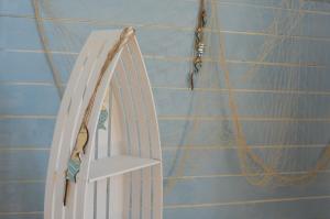 a white shelf in a room with a rope at OSADA NA WYSPIE in Gdańsk +64 photos
