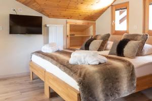 Postel nebo postele na pokoji v ubytování Hôtel Dents de Veisivi