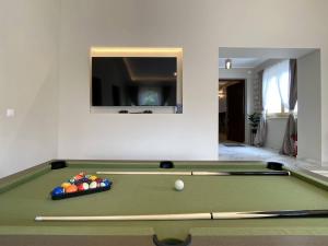 a green pool table with a ball on it at Villa Zorica in Poreč