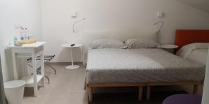 Postel nebo postele na pokoji v ubytování B&B - Uva Residence
