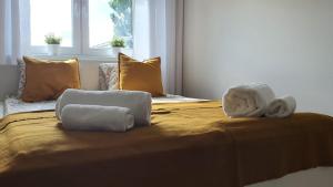 Posteľ alebo postele v izbe v ubytovaní Apartament WILKASY (k. Giżycka)