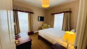 A bed or beds in a room at iSleep at The Lowther 