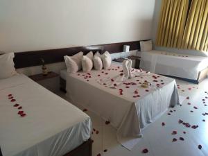 
A bed or beds in a room at Hotel Gran Minas
