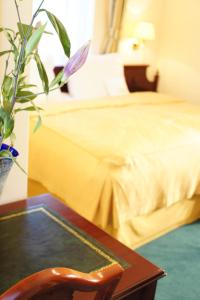 Posteľ alebo postele v izbe v ubytovaní Hotel Mignon