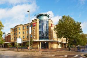 a building with a glass dome on top of it at ibis London Stratford in London