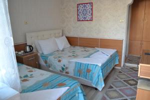 Кровать или кровати в номере Aspawa Hotel