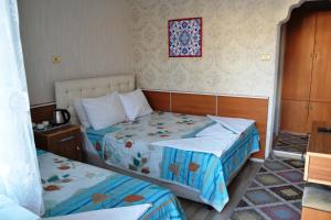 Кровать или кровати в номере Aspawa Hotel