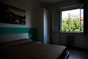 Postel nebo postele na pokoji v ubytování Lorenteggio 209