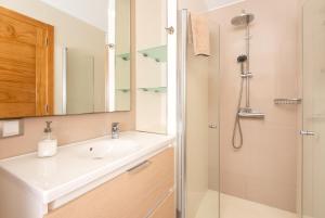 a bathroom with a sink and a shower at Apartamentos Las Palmeras in Puerto de Mogán +81 photos