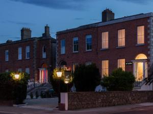 a large brick building with lights in front of it at No 9 Rathgar in Rathgar