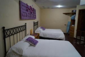Letto o letti in una camera di J&K Suite