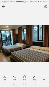 Postel nebo postele na pokoji v ubytování Hong Kong Hotel