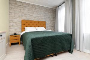 Postel nebo postele na pokoji v ubytování Magasini Fine Estate Apartments