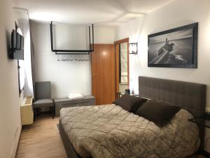 a bedroom with a large bed in a room at Villa Trevisi - ROOMS -free parking in Treviso