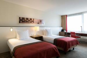 Postel nebo postele na pokoji v ubytování Holiday Inn Eindhoven Centre by IHG