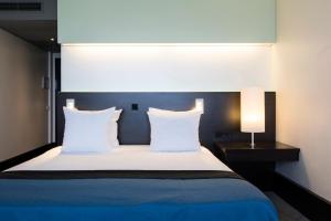 Postel nebo postele na pokoji v ubytování Holiday Inn Eindhoven Centre by IHG