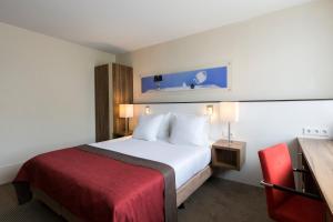 Postel nebo postele na pokoji v ubytování Holiday Inn Eindhoven Centre by IHG