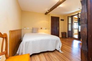 Giường trong phòng chung tại Casa Marieta Escarrilla