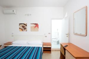 Postel nebo postele na pokoji v ubytování Hotel Helios