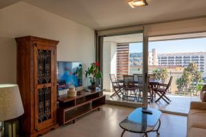 TV a/nebo společenská místnost v ubytování Apartamento Lu Ambassador