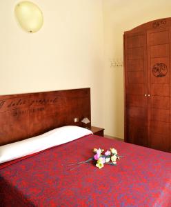 מיטה או מיטות בחדר ב-I Dolci Grappoli