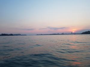 a sunset over a body of water at BIENNALE FLAT IN GIARDINI in Venice