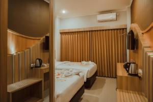 Voodi või voodid majutusasutuse panfila hotel toas