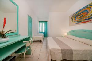 Postel nebo postele na pokoji v ubytování Hotel Marinaro