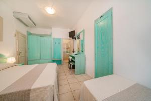Postel nebo postele na pokoji v ubytování Hotel Marinaro