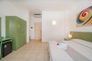 Postel nebo postele na pokoji v ubytování Hotel Marinaro