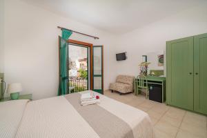 Postel nebo postele na pokoji v ubytování Hotel Marinaro