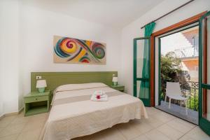 Postel nebo postele na pokoji v ubytování Hotel Marinaro
