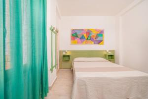 Postel nebo postele na pokoji v ubytování Hotel Marinaro