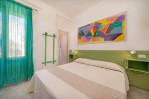 Postel nebo postele na pokoji v ubytování Hotel Marinaro