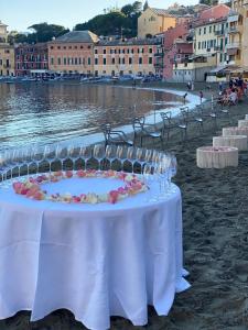a table set up on the beach with at Hotel Miramare & Spa in Sestri Levante