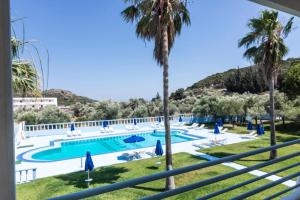 a view of the pool from the balcony of a resort at Tivoli Hotel in Faliraki