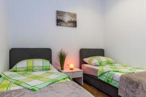 Llit o llits en una habitació de Rooms and Apartments Budiša