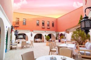 a patio of a restaurant with tables and chairs at ÂLÂ HAN BOUTIQUE HOTEL in Urfa