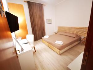 En eller flere senge i et værelse på Palermo Inn Apartment