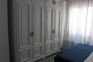 Łóżko lub łóżka w pokoju w obiekcie Alojamiento La Cochera