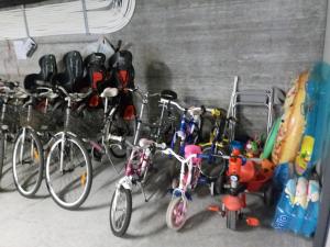 a bunch of bikes parked in a garage at Le Vele Residence in Pietra Ligure